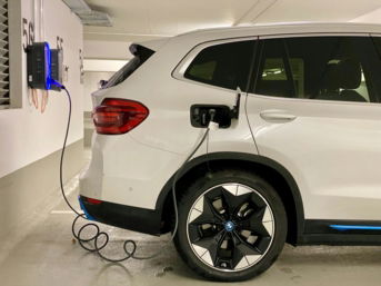 an-electric-car-plugged-in-to-a-charging-station.jpg an electric car plugged in to a charging station